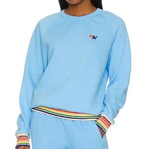 Aviator Nation Sky Blue Crewneck with Rainbow Tag Detail